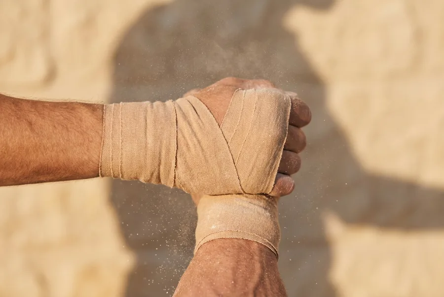 An athlete's taped wrist mid-wrap